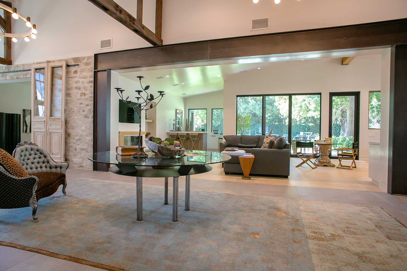 Finished interior with a wide steel beam over the opening