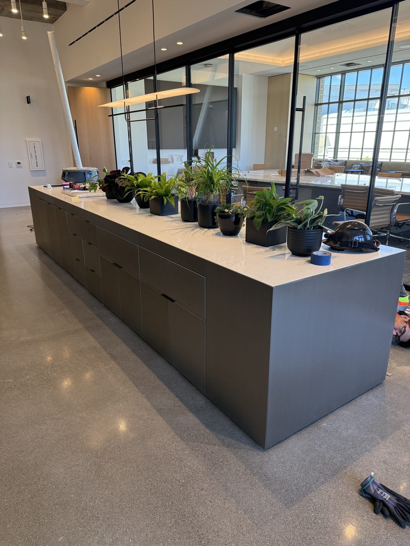 Dark patina stainless island in an office kitchen